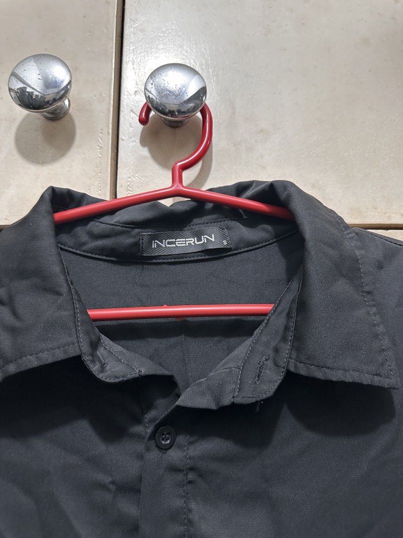 INCERUN Black Oversized Collar Shirt Size S (Category: Tshirts & Polo Shirts ) located in Manila. Submitted by vicnoay (Listing ID 1468279023, Image 2). Description: - Brand: INCERUN - Color: Black - Size: Small (Oversized fit) - Details: Half sleeves, chest pocket, classic collar - Fabric: Smooth and lightweight - Style: Minimalist streetwear - Condition: Good overall condition.