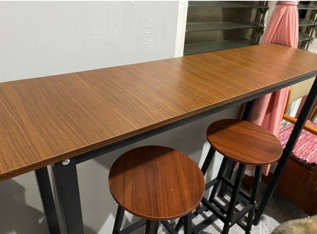 Industrial Bar Table with Two Stools (Category: Tables & Sets) located in Taguig. Submitted by rabbys (Listing ID 1468184794, Image 3). Description: - Set includes: 1 wooden top breakfast bar table (47 inches long) and 2 matching round stools - Design: Modern clean lines with sturdy black metal frames - Space-Saving: Compact footprint, ideal for small spaces, kitchen corners, or cozy dining areas - Maintenance: Easy to wipe down and maintain - Co