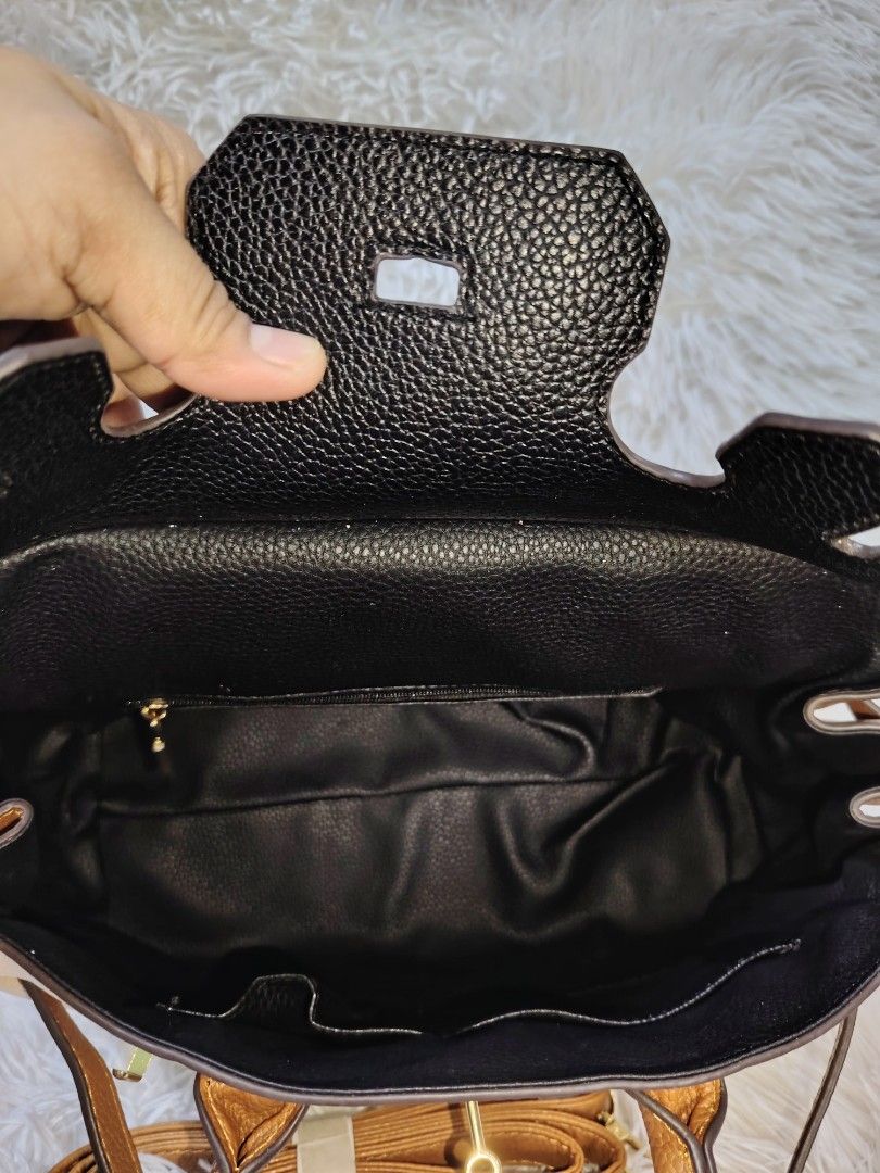 Large Tri-Color Handbag Slingbag (Category: Cross-body Bags) located in Quezon City. Submitted by zhelcloset01 (Listing ID 1468237271, Image 3). Description: Large tri-color handbag and sling bag. Black, beige, and brown color block design with gold-tone hardware. Double top handles and a detachable, adjustable brown shoulder strap included. Structured silhouette with twist-lock closure detail on the front flap. Clean textured faux leather materi