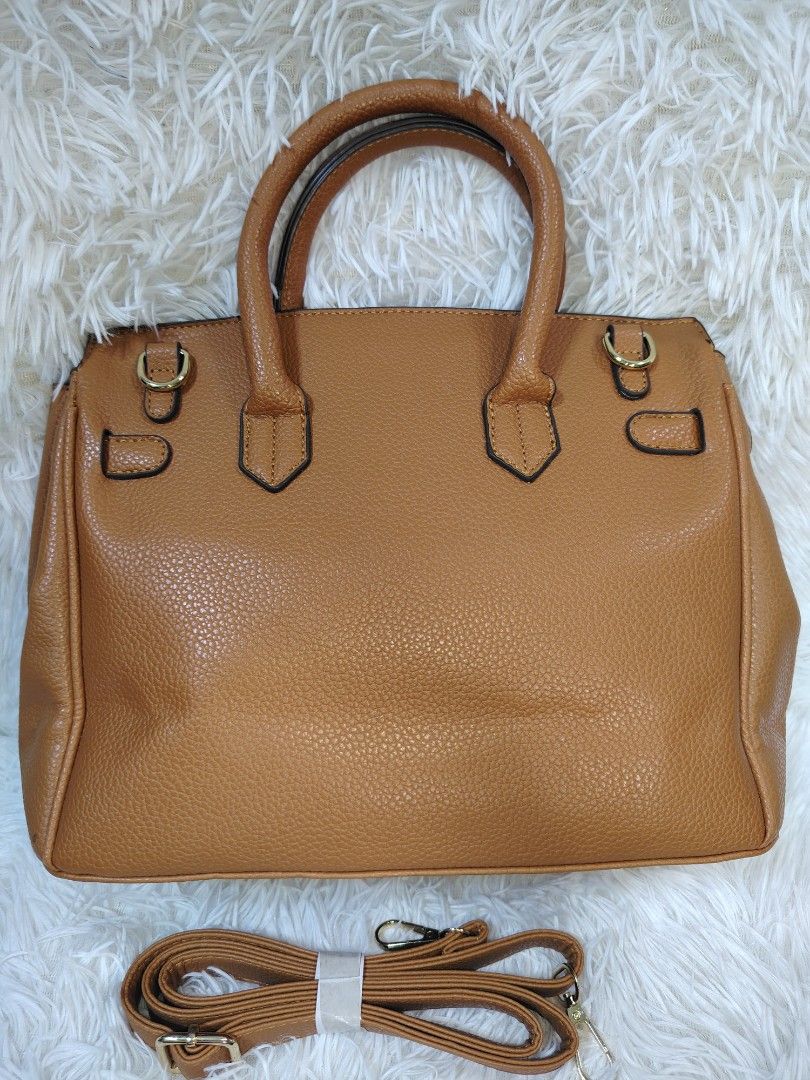 Large Tri-Color Handbag Slingbag (Category: Cross-body Bags) located in Quezon City. Submitted by zhelcloset01 (Listing ID 1468237271, Image 2). Description: Large tri-color handbag and sling bag. Black, beige, and brown color block design with gold-tone hardware. Double top handles and a detachable, adjustable brown shoulder strap included. Structured silhouette with twist-lock closure detail on the front flap. Clean textured faux leather materi