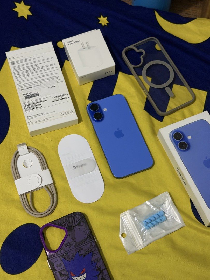 iPhone 16 with warranty (Category: iPhone 16 Series) located in Taguig. Submitted by cabspanda (Listing ID 1468105973, Image 1). Description: Model: iPhone 16 personal used - Color: Ultramarine - Storage: 128GB - Battery Health: 88% - Warranty: Valid until October 24, 2026 - Inclusions: Original box, charging cable, USB-C power adapter, and 2 phone cases (including a Pokémon Gengar case) - Condition: Excellent, well-maintained - MOP: GCash / Bank
