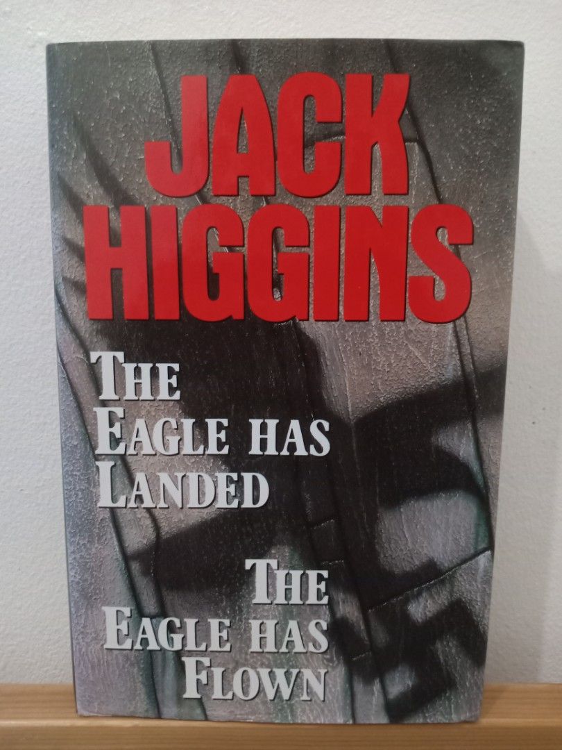 Jack Higgins The Eagle Has Landed and The Eagle Has Flown (Category: Storybooks) located in Bacolor. Submitted by appletun (Listing ID 1468153778, Image 1). Description: - 2-in-1 Hardbound volume featuring classic Jack Higgins thrillers - Includes 'The Eagle Has Landed' and 'The Eagle Has Flown' - Striking bold red title lettering on textured cover - Perfect for fans of suspense and wartime fiction.