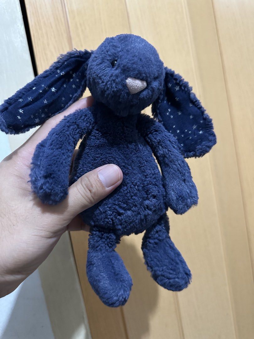 Jellycat Starlight Bunny Plush Toy rare (Category: Plushies & Soft Toys) located in Manila. Submitted by naixor_thrift (Listing ID 1468087253, Image 1). Description: - Authentic Jellycat Starlight Bunny in navy blue - Adorable star print on both floppy ears - Ultra-soft velvety fur with bean filling for a nice, weighted feel - Original tag still attached - Safe and suitable for newborns (from birth) - Clean, well-maintained, and ready to ship.