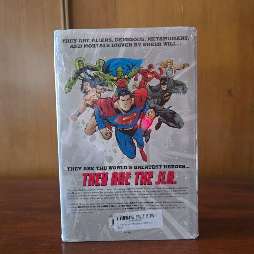 JLA by Grant Morrison Omnibus DC Comics Hardcover (Category: Comics & Manga) located in Quezon City. Submitted by winmadtrading (Listing ID 1468250968, Image 3). Description: - Title: JLA by Grant Morrison Omnibus Hardcover - Creators: Written by Grant Morrison with art by Howard Porter, John Dell, and Pat Garrahy - Contents: Collects the legendary JLA run plus JLA: Earth 2 and JLA: One Million event material - Condition: Massive hardcover volume