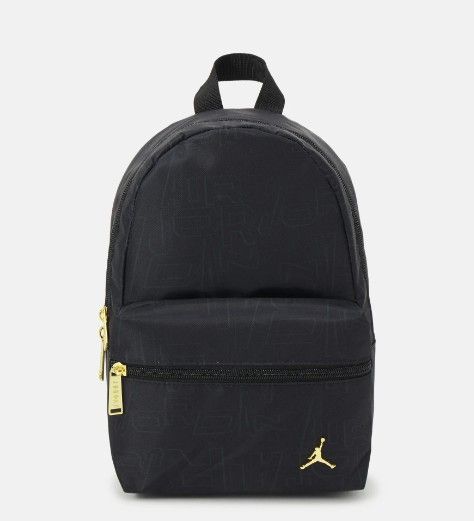 Jordan Black and Gold Monogram Backpack (Category: Backpacks) located in Mandaluyong City. Submitted by swiftbird_ed6c34 (Listing ID 1468101575, Image 1). Description: - Brand new, sealed in original plastic packaging with original tags attached - Sleek black design featuring all-over tonal debossed monogram lettering - Premium gold hardware accents, including the front zipper pull and iconic Jumpman logo badge - Comfortable breathable mesh back 