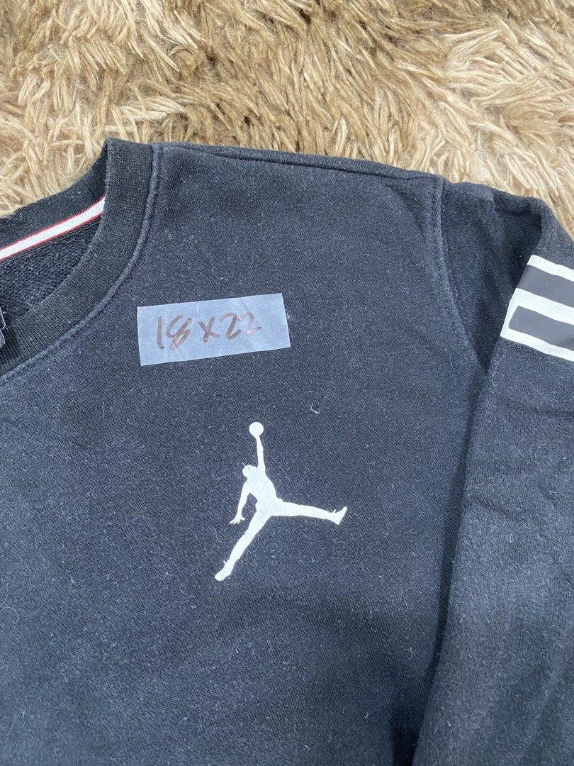 Jordan Black Sweatshirt (Category: Coats, Jackets and Outerwear) located in Cagayan de Oro. Submitted by sepamorash53558 (Listing ID 1468266418, Image 2). Description: - Brand: Jordan - Color: Black - Size: M (150/72) - Jumpman logo printed on the chest - Big Jordan lettering across the back shoulders issue lints - Colorful graphic patch near the bottom hem - Striped ribbing inside the collar - Comfortable pullover style for casual wear - Trusted