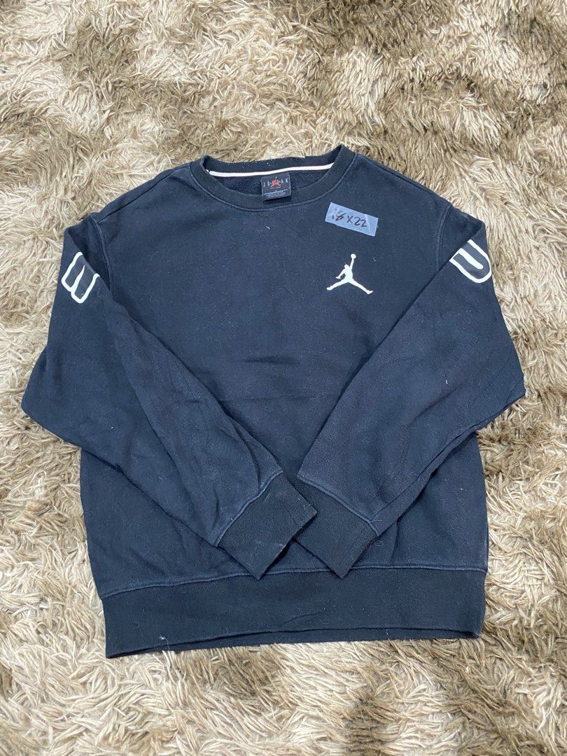 Jordan Black Sweatshirt (Category: Coats, Jackets and Outerwear) located in Cagayan de Oro. Submitted by sepamorash53558 (Listing ID 1468266418, Image 1). Description: - Brand: Jordan - Color: Black - Size: M (150/72) - Jumpman logo printed on the chest - Big Jordan lettering across the back shoulders issue lints - Colorful graphic patch near the bottom hem - Striped ribbing inside the collar - Comfortable pullover style for casual wear - Trusted