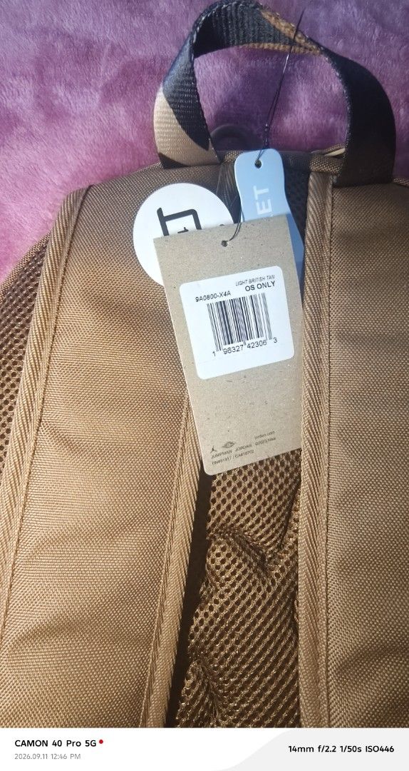 Jordan Light British Tan Backpack (Category: Backpacks) located in Mandaluyong City. Submitted by swiftbird_ed6c34 (Listing ID 1468101008, Image 3). Description: - Brand new with original tags attached - Color: Light British Tan - Bold curved Jordan lettering across the front - Two front zipper pockets featuring the iconic Jumpman logo - Breathable mesh padding on back straps for comfort - Sturdy top carry handle included.