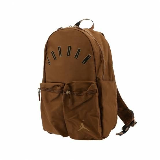 Jordan Light British Tan Backpack (Category: Backpacks) located in Mandaluyong City. Submitted by swiftbird_ed6c34 (Listing ID 1468101008, Image 1). Description: - Brand new with original tags attached - Color: Light British Tan - Bold curved Jordan lettering across the front - Two front zipper pockets featuring the iconic Jumpman logo - Breathable mesh padding on back straps for comfort - Sturdy top carry handle included.