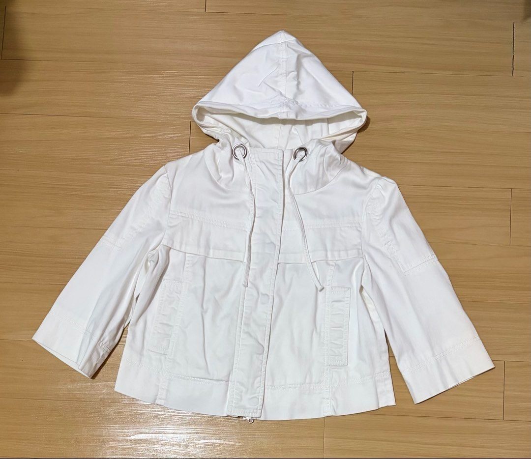 Juicy Couture White Cropped Hooded Jacket Small - Medium (Category: Coats, Jackets and Outerwear) located in Quezon City. Submitted by garagesale2026 (Listing ID 1468078854, Image 1). Description: - Preloved - In very good condition - Very nice in actual - Fits up to Medium - Button and zip closure - Adjustable drawstring details at the neck - Three-quarter length sleeve.