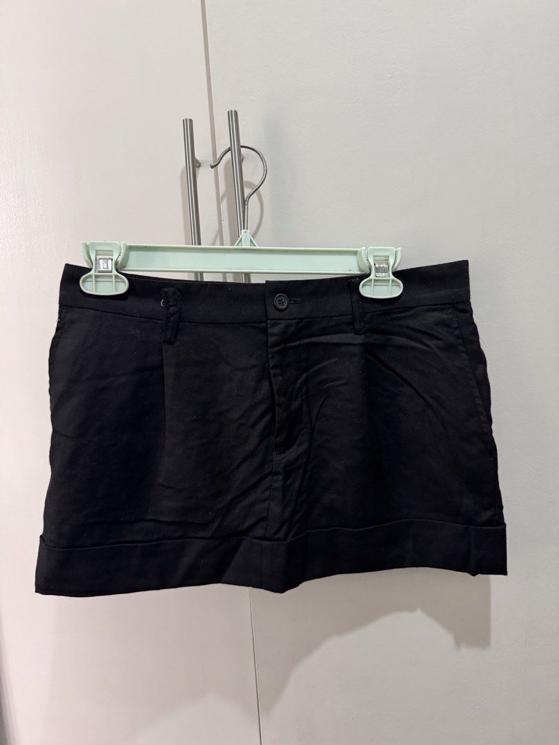 JUNYA WATANABE Wool Mini Skirt Black Size L (Category: Skirts) located in Rosales. Submitted by thriftingismygame (Listing ID 1468178993, Image 2). Description: - Brand: Junya Watanabe Comme des Garçons (AD2009) - Style: Black wool mini skirt with front pleats and wide hem - Size: L - Material: 85% wool, 15% mohair; 100% cupro lining - Origin: Made in Japan - Features: Tailored waistband, button closure, and zip fly - Care: Dry clean only - Condi