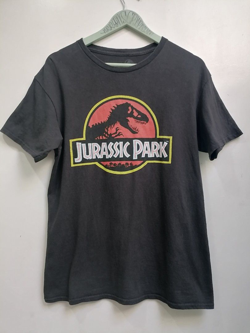 Jurasic Park Shirt (Category: Tshirts & Polo Shirts ) located in San Mateo. Submitted by arrowscrap_delight (Listing ID 1468277905, Image 1). Description: Jurassic Park Shirt Good Condition Made in Honduras 100% Cotton Size Medium Length : 27.5" Width : 19.5" Issues : Minimal Hairline Crack on Print (5th photo) and Repaired Loose Hem Stitching (last photo) Washed ,Ready to Wear 180 + SF.