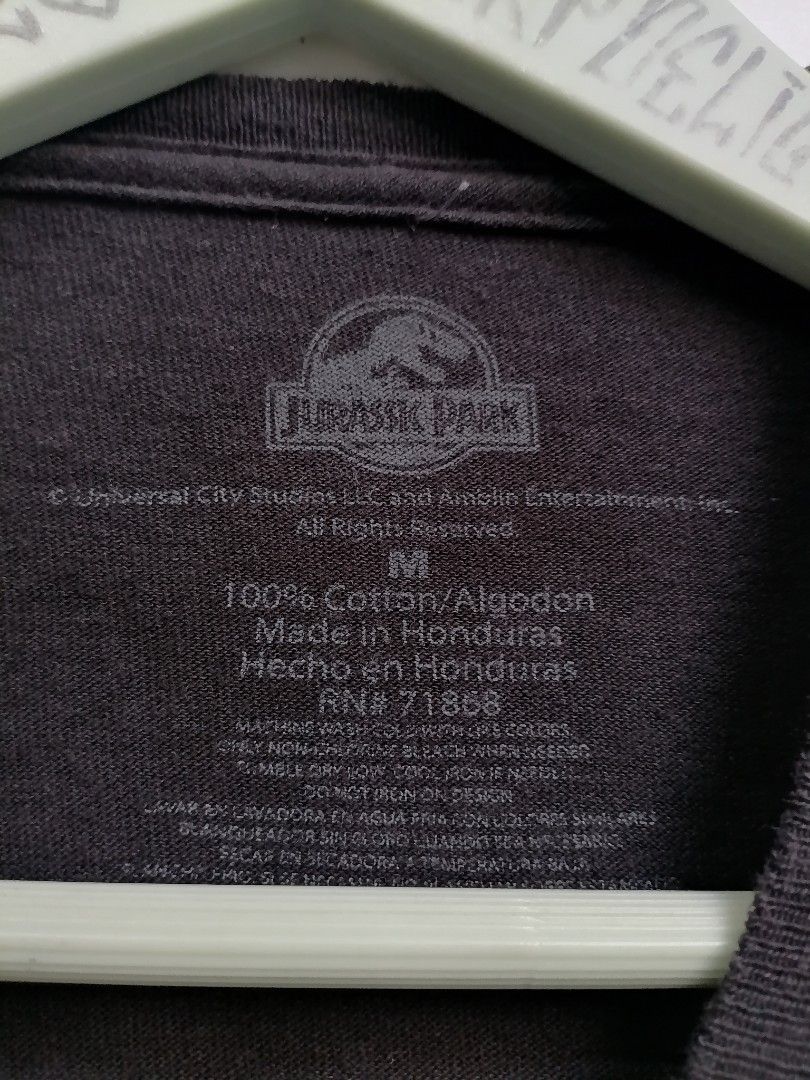 Jurasic Park Shirt (Category: Tshirts & Polo Shirts ) located in San Mateo. Submitted by arrowscrap_delight (Listing ID 1468277905, Image 3). Description: Jurassic Park Shirt Good Condition Made in Honduras 100% Cotton Size Medium Length : 27.5" Width : 19.5" Issues : Minimal Hairline Crack on Print (5th photo) and Repaired Loose Hem Stitching (last photo) Washed ,Ready to Wear 180 + SF.