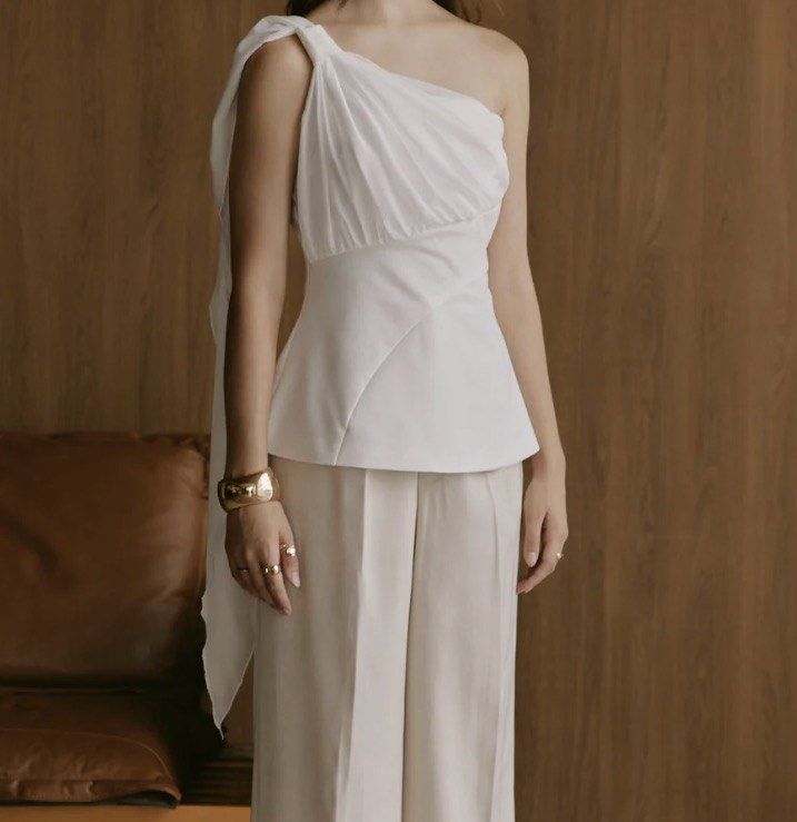 Just Because Studio Cecilia Top XS (Category: Sleeveless) located in Pasig City. Submitted by oonomatopoeia (Listing ID 1468225682, Image 1). Description: - Elegant - Has a draping over the shoulder effect - Used a few times - OG Price: ₱2500 - RFS: big on me na Delivery via SDD only (Lala, Grab) 📍Mandaluyong, Metro Manila.