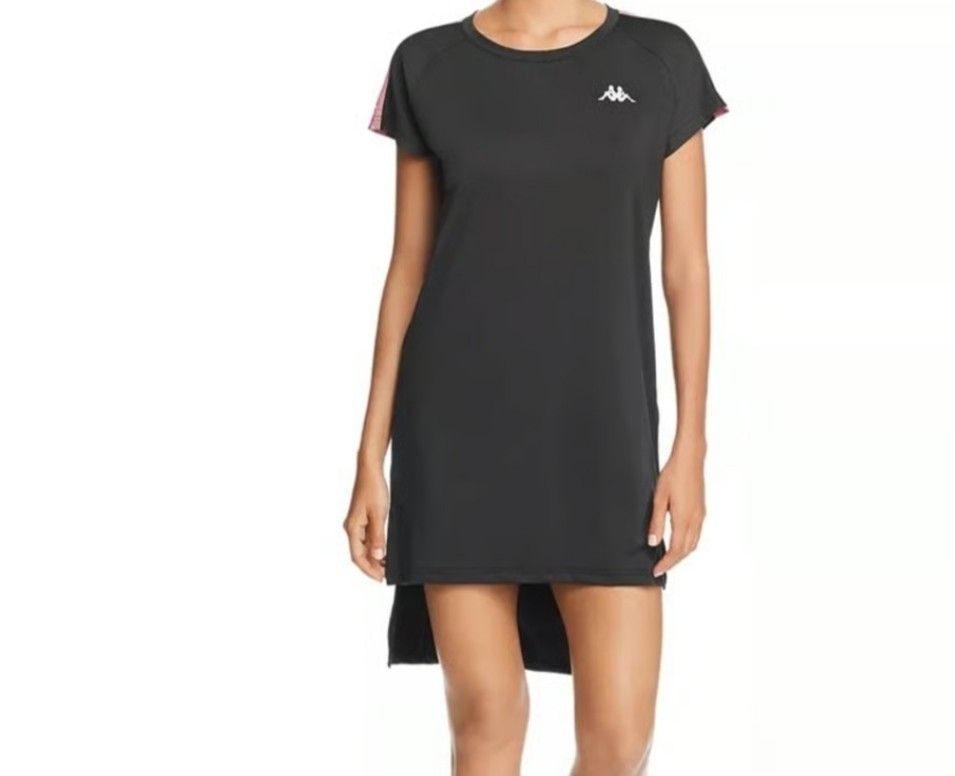 Kappa Black Athletic Dress Medium (Category: Dresses) located in Manila. Submitted by lene48 (Listing ID 1468142122, Image 2). Description: - Brand: Kappa - Color: Black with white accents - Size: Medium - Design: Short sleeves, white logo on chest, and white shoulder taping - Hemline: High-low (slightly longer back) - Condition: Excellent - Perfect for casual wear and sporty outfits.