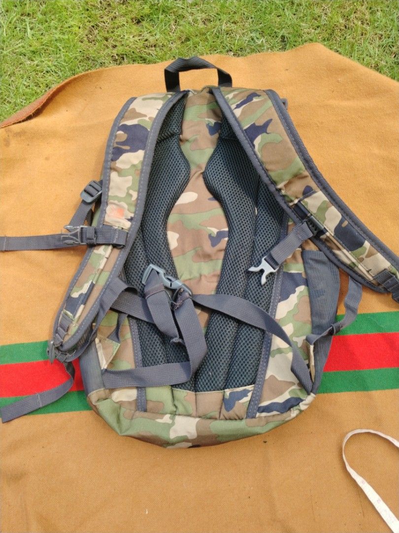Karrimor Urban Camouflage Backpack (Category: Backpacks) located in Legazpi City. Submitted by genobecollectives (Listing ID 1468079389, Image 2). Description: - Brand: Karrimor - Design: Urban camo pattern (brown, green, black) with striking orange bungee cord - Storage: Main compartment with interior slip pocket and convenient mesh side pockets - Comfort: Padded mesh shoulder straps for all-day wear - Material: 100% durable polyester - Conditio