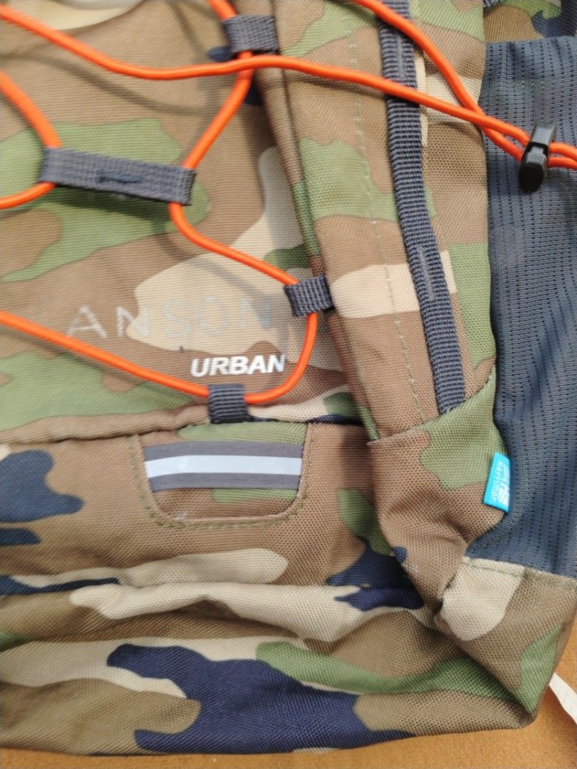 Karrimor Urban Camouflage Backpack (Category: Backpacks) located in Legazpi City. Submitted by genobecollectives (Listing ID 1468079389, Image 3). Description: - Brand: Karrimor - Design: Urban camo pattern (brown, green, black) with striking orange bungee cord - Storage: Main compartment with interior slip pocket and convenient mesh side pockets - Comfort: Padded mesh shoulder straps for all-day wear - Material: 100% durable polyester - Conditio