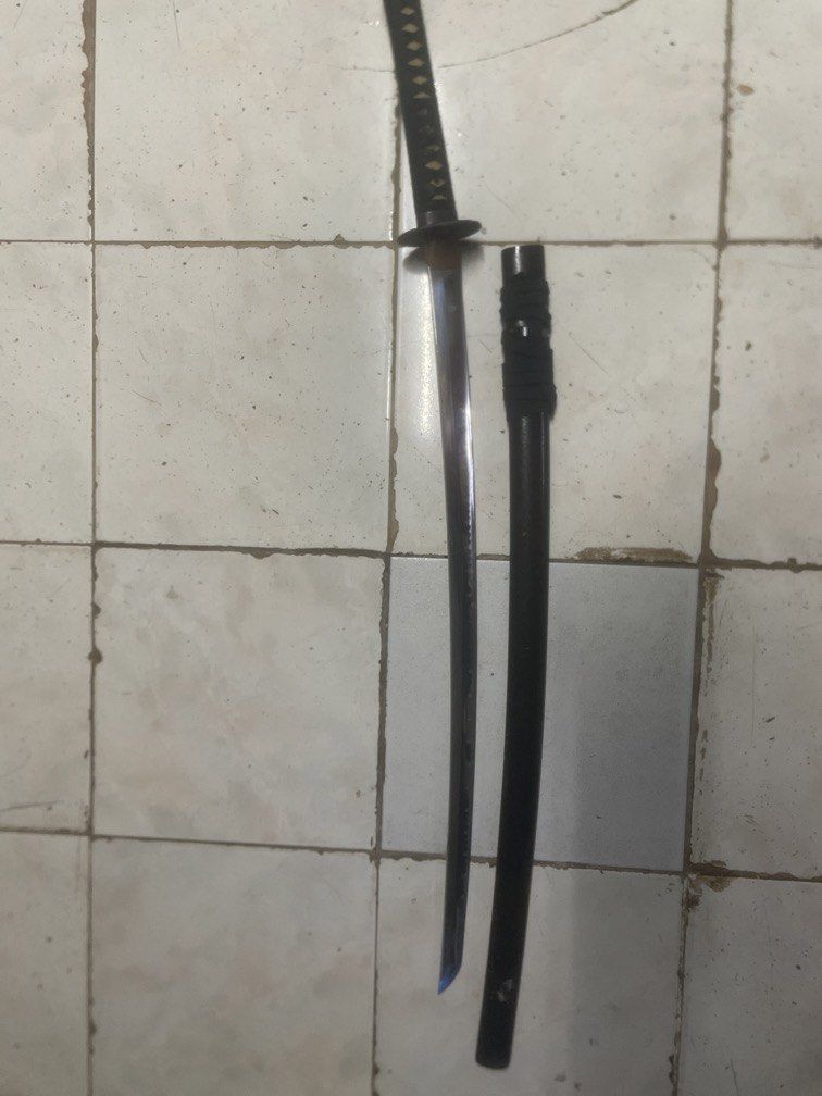 Katana sword + Bokken sword (Category: Vintage Collectibles) located in Manila. Submitted by johnsamuel911 (Listing ID 1468172938, Image 1). Description: Black katana sword with sheath complete with additional bokken sword negotiable.