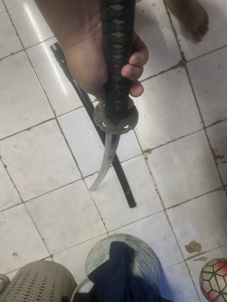 Katana sword + Bokken sword (Category: Vintage Collectibles) located in Manila. Submitted by johnsamuel911 (Listing ID 1468172938, Image 2). Description: Black katana sword with sheath complete with additional bokken sword negotiable.