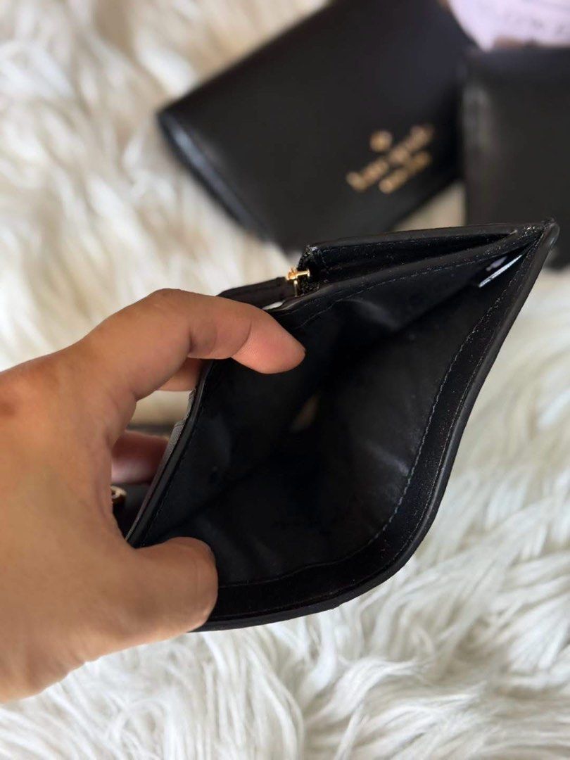 Kate Spade Black Saffiano Leather Wallet (Category: Wallets & Card holders) located in Manila. Submitted by clairetot (Listing ID 1468131667, Image 2). Description: Authentic Black Kate Spade Wallet in durable Saffiano leather. Compact, chic, and features gold hardware with a secure snap closure. Includes card slots, a zippered coin pocket, and a billfold. Perfect for small bags..