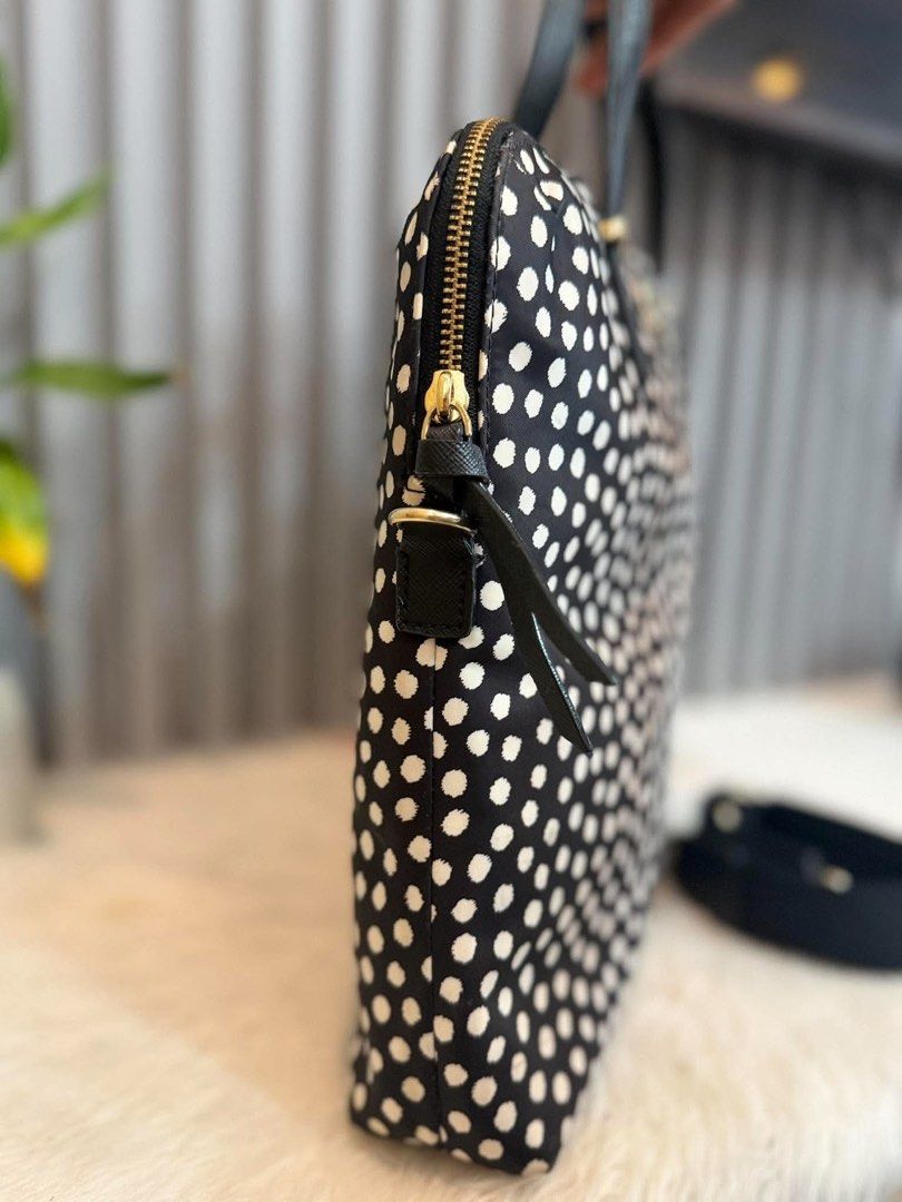 Kate Spade Black White Polka Dot Laptop Bag (Category: Tote Bags) located in Manila. Submitted by angel.valle (Listing ID 1468168580, Image 3). Description: - Brand: Kate Spade - Design: Classic black with white polka dots and gold-tone hardware - Closure: Secure zip-top closure - Portability: Dual top carry handles and a detachable black shoulder strap - Interior: Signature fabric lining with built-in compartments for tech and essentials - Condi