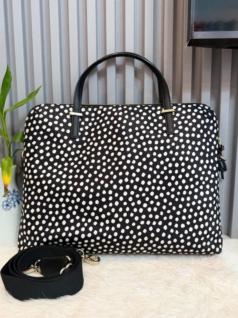 Kate Spade Black White Polka Dot Laptop Bag (Category: Tote Bags) located in Manila. Submitted by angel.valle (Listing ID 1468168580, Image 2). Description: - Brand: Kate Spade - Design: Classic black with white polka dots and gold-tone hardware - Closure: Secure zip-top closure - Portability: Dual top carry handles and a detachable black shoulder strap - Interior: Signature fabric lining with built-in compartments for tech and essentials - Condi