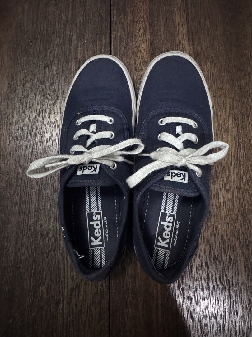 Keds Navy Blue Canvas Sneakers US 8 (Category: Sneakers) located in Manila. Submitted by lisa.ono (Listing ID 1468143234, Image 1). Description: - Brand: Keds - Color: Navy Blue - Size: US 8 / UK 5.5 / EUR 39 - Style: Classic low-top canvas sneakers with white laces and rubber soles - Condition: Worn a few times; fabric is in solid shape with no tears or major stains, soles have minor dirt from normal outdoor wear.