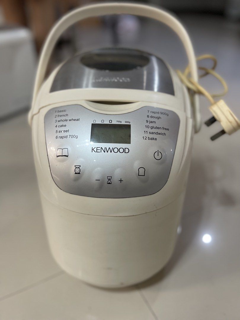 Kenwood Bread Maker Machine with Multiple Baking Settings (Category: Breadmakers) located in Cainta. Submitted by mysticmountain.f41a31 (Listing ID 1468248331, Image 1). Description: Features a digital top panel with 12 preset programs (basic, french, whole wheat, dough), a clear viewing window, and a convenient carrying handle. Perfect for effortless home baking. PM if interested! Issue: Digital screen not visible and light is busted….