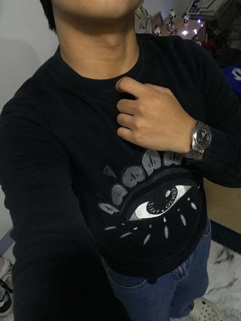 Kenzo Paris Eye Sweatshirt Black (Category: Coats, Jackets and Outerwear) located in Manila. Submitted by mikeee03 (Listing ID 1468208030, Image 3). Description: - Brand: Kenzo - Design: Iconic front eye graphic - Color: Classic Black - Size: Small - Details: Ribbed crew neck, cuffs, and hem - Condition: Excellent, well-maintained - Style Tip: Versatile piece, easy to match with denim or joggers - Issue: None - Color rates: 10/10.