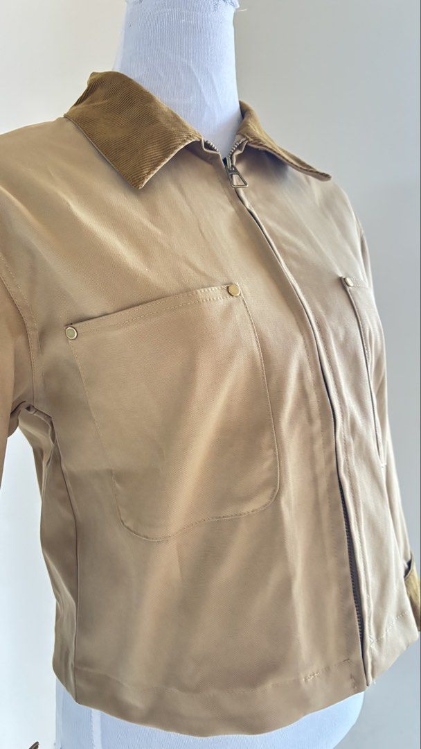 Khaki Corduroy Collar Zip-Up Utility Jacket (Category: Coats, Jackets and Outerwear) located in Baguio. Submitted by zenforest.fd186d (Listing ID 1468222679, Image 2). Description: - Color & Style: Khaki utility jacket with contrast brown corduroy collar and cuffs - Closure: Full zip front closure - Pockets: Two front chest pockets with metallic snap buttons - Fit: Trendy cropped, boxy fit - Fabric: Single-layer design, perfect for autumn and win