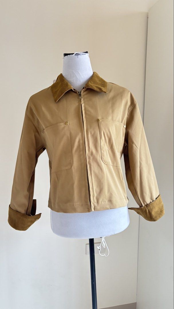 Khaki Corduroy Collar Zip-Up Utility Jacket (Category: Coats, Jackets and Outerwear) located in Baguio. Submitted by zenforest.fd186d (Listing ID 1468222679, Image 1). Description: - Color & Style: Khaki utility jacket with contrast brown corduroy collar and cuffs - Closure: Full zip front closure - Pockets: Two front chest pockets with metallic snap buttons - Fit: Trendy cropped, boxy fit - Fabric: Single-layer design, perfect for autumn and win