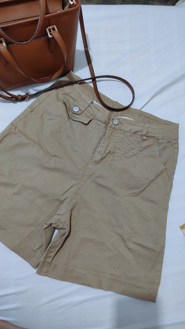 Khaki Shorts High Waisted Utility Pockets (Category: Shorts) located in Bacolor. Submitted by annjjjjj (Listing ID 1468084830, Image 1). Description: - Color: Khaki / Neutral brown - Material: Sturdy, durable cotton - Features: Functional front pockets, belt loops, smooth zipper fly with button closure - Fit: Mid-length style - Condition: Great for casual everyday wear and easy to match with basic tops.