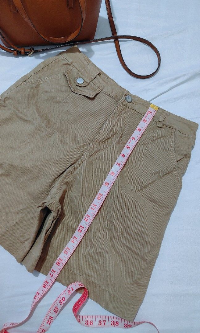 Khaki Shorts High Waisted Utility Pockets (Category: Shorts) located in Bacolor. Submitted by annjjjjj (Listing ID 1468084830, Image 3). Description: - Color: Khaki / Neutral brown - Material: Sturdy, durable cotton - Features: Functional front pockets, belt loops, smooth zipper fly with button closure - Fit: Mid-length style - Condition: Great for casual everyday wear and easy to match with basic tops.