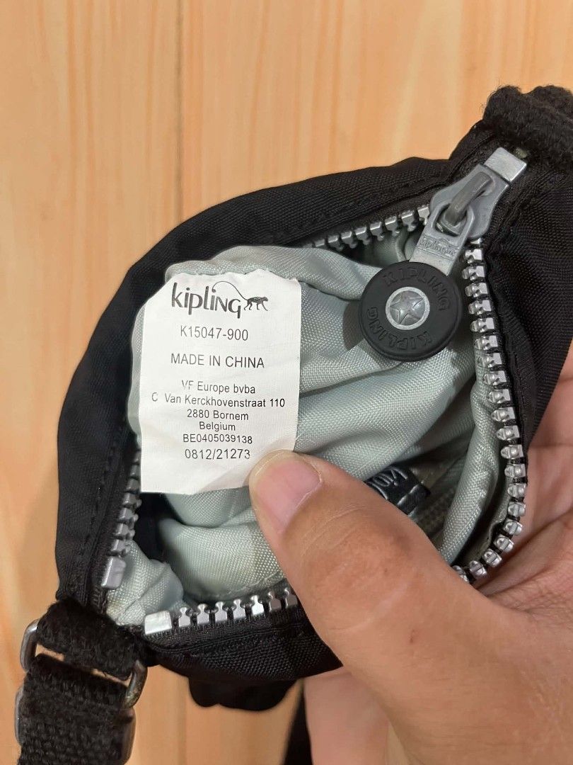 Kipling Black Crossbody Bag K15047-900 (Category: Cross-body Bags) located in Daraga. Submitted by thethriftcity2024 (Listing ID 1468104983, Image 2). Description: - Authentic black Kipling crossbody bag (Model K15047-900) - Crafted from durable, lightweight nylon material - Multiple exterior zippered pockets with signature round pull tags - Long adjustable strap for a comfortable, custom fit - Includes the iconic black monkey keychain - Compact 