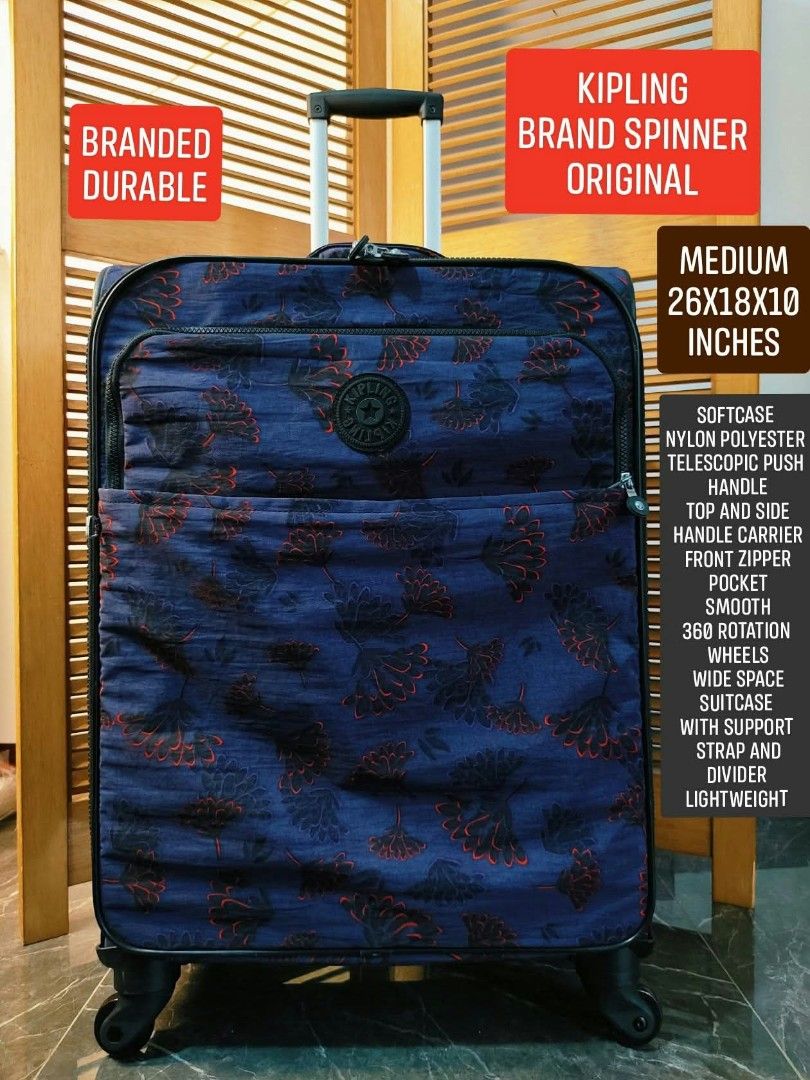 Kipling Spinner Softcase Medium Luggage Blue Floral (Category: Luggage) located in Valenzuela. Submitted by gracebacot17959 (Listing ID 1468096974, Image 1). Description: - Brand: Kipling - Type: Medium softcase luggage - Color/Design: Blue with dark floral pattern - Dimensions: 26" x 18" x 10" - Material: Lightweight nylon polyester - Mobility: Smooth 360-degree rotating wheels & telescopic push handle - Storage: Front zipper pocket & roomy inte
