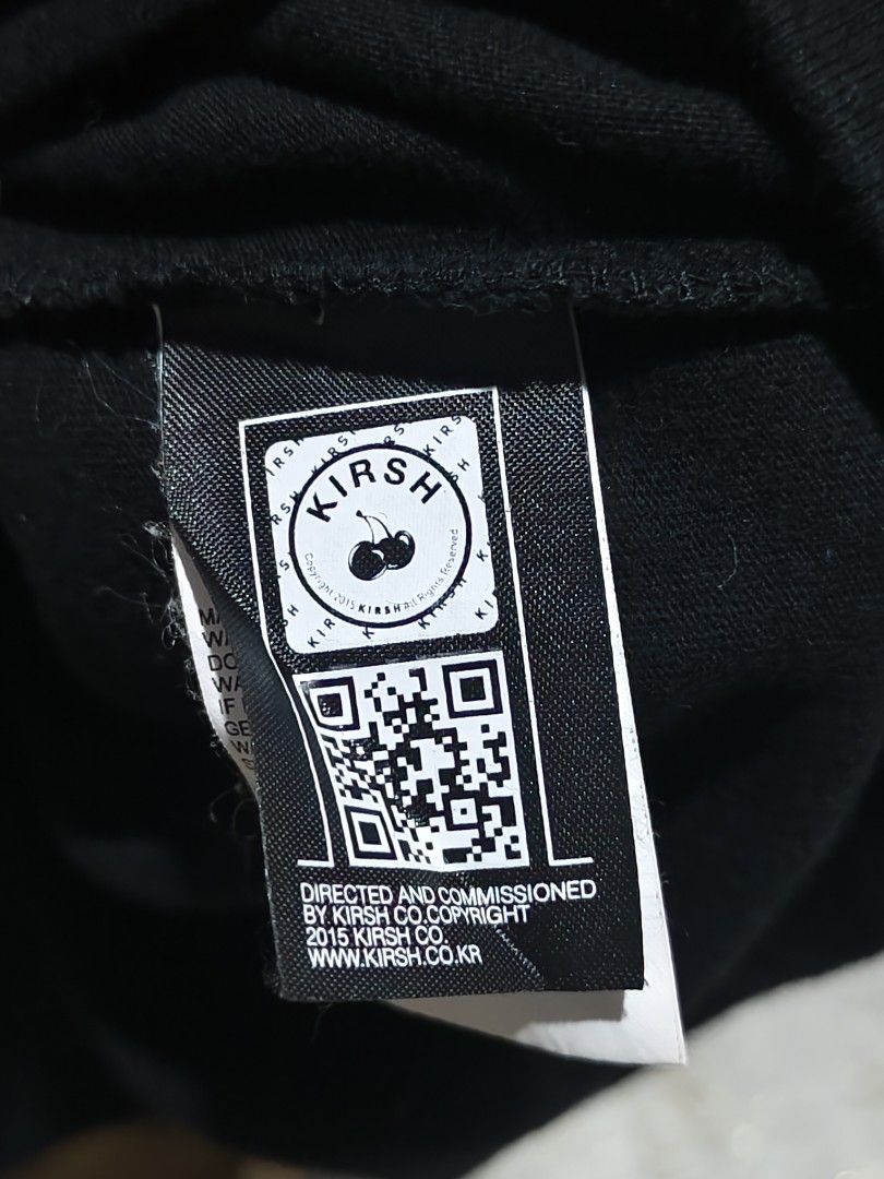 Kirsh Black Cherry Logo Tee Size 1 (Category: Shirts) located in Bayugan. Submitted by boss_rej (Listing ID 1468189177, Image 3). Description: - Brand: Kirsh (Made in South Korea) - Color: Black with iconic large cherry graphic on front & embroidered cherry on sleeve - Size: Size 1 (Standard fit, short sleeve crewneck) - Material: 100% Cotton (Machine washable) - Authenticity: Includes interior brand tag and QR code authentication tag on care lab