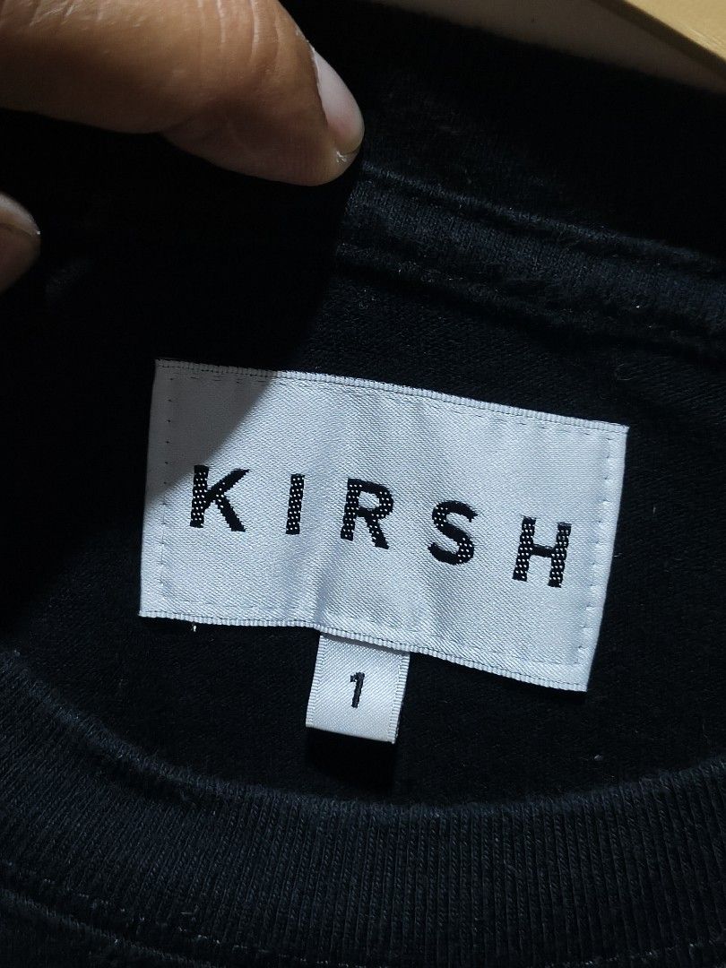 Kirsh Black Cherry Logo Tee Size 1 (Category: Shirts) located in Bayugan. Submitted by boss_rej (Listing ID 1468189177, Image 2). Description: - Brand: Kirsh (Made in South Korea) - Color: Black with iconic large cherry graphic on front & embroidered cherry on sleeve - Size: Size 1 (Standard fit, short sleeve crewneck) - Material: 100% Cotton (Machine washable) - Authenticity: Includes interior brand tag and QR code authentication tag on care lab
