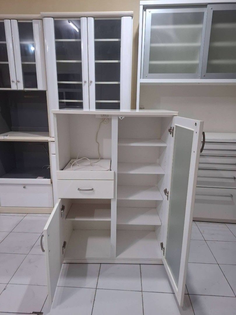 Kitchen Counter Buffet Sideboard Cabinet Coffee Nook (Category: Shelves, Cabinets & Racks) located in Quezon City. Submitted by dannikkishoppe2 (Listing ID 1468283265, Image 2). Description: Kitchen Counter Buffet Sideboard Cabinet Coffee Nook ‼️₱7500‼️ *mdf, solid wood, plyboard, frosted glass doors *adjustable shelves *with pullout shelf and built-in outlet for microwave, rice cooker, or other appliances • in good condition Please manage your e