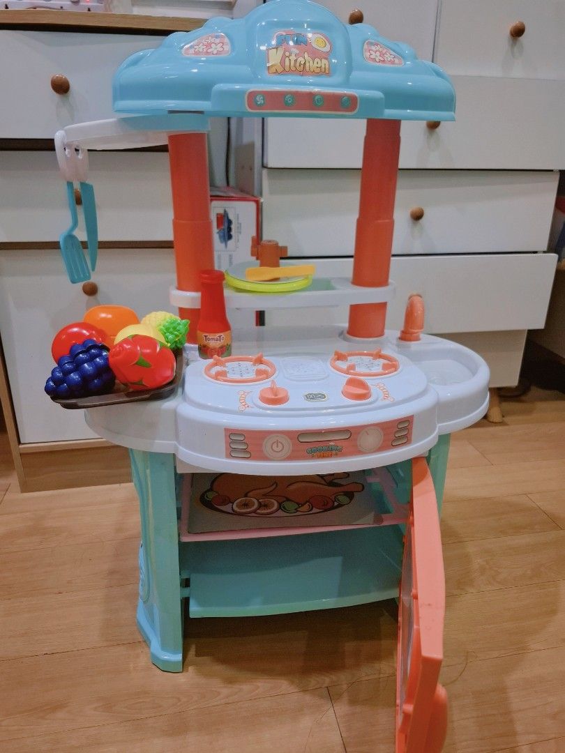 Kitchen Pretend Play Toy Set with Lights & Sounds (Includes Accessories) (Category: Kids Toys) located in Manila. Submitted by shanfern1412 (Listing ID 1468071773, Image 3). Description: Features & Details: ​Interactive Stove: Burner features working lights & cooking sounds ​Power Requirement: Battery operated (requires 3 x AA batteries—not included) ​Includes Accessories: ​Assorted play fruits & vegetables (grapes, orange, lemon, tomato, etc.) ​