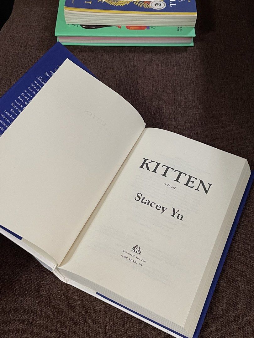 Kitten: A Novel by Stacey Yu Hardcover (Category: Storybooks) located in Malaybalay. Submitted by fundthismaterialgirl (Listing ID 1467605232, Image 2). Description: - Title: Kitten by Stacey Yu - Format: Hardcover Edition SO HARD TO FIND IN THE PHILIPPINES - Design: Beautiful blue cover with pearl-framed cat face artwork - Condition: Excellent condition, bought this September. - Laufey Book Club reco - originally 1,450 on fully booked - RFS: dec