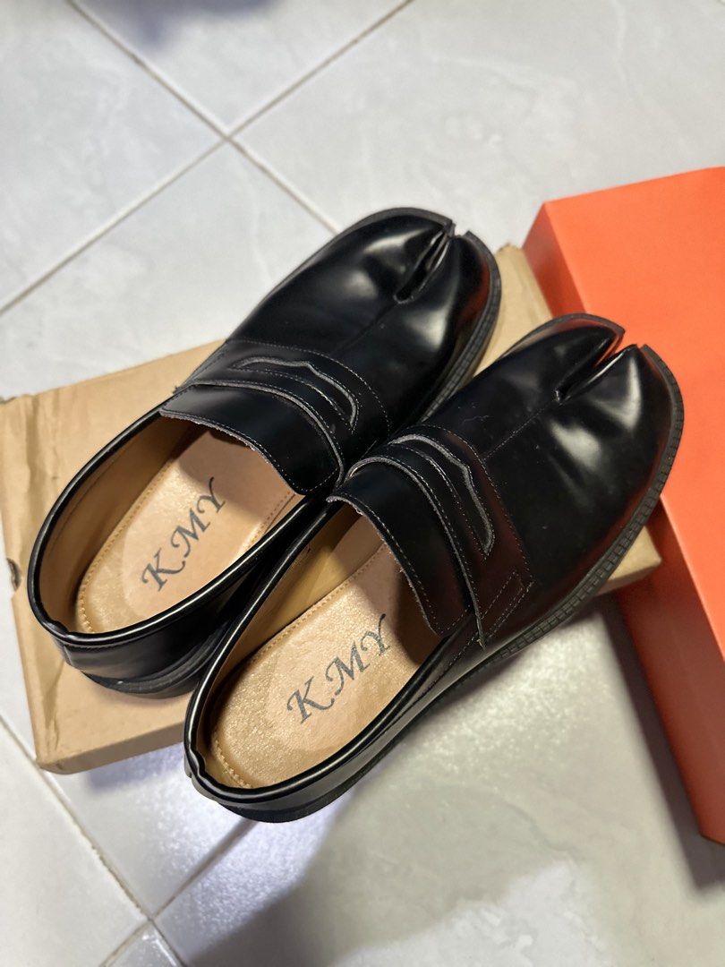 KMY Matte Black Split-Toe Tabi Loafers Size 41 (Category: Loafers) located in Makati City. Submitted by its.ptrck (Listing ID 1468114994, Image 3). Description: - Brand: KMY - Color: Matte black - Size: 41 - Design: Unique split-toe (tabi) with classic penny loafer strap - Sole: Chunky lug sole with excellent grip - Condition: Minimal wear on soles - Inclusion: Original branded box ingat .