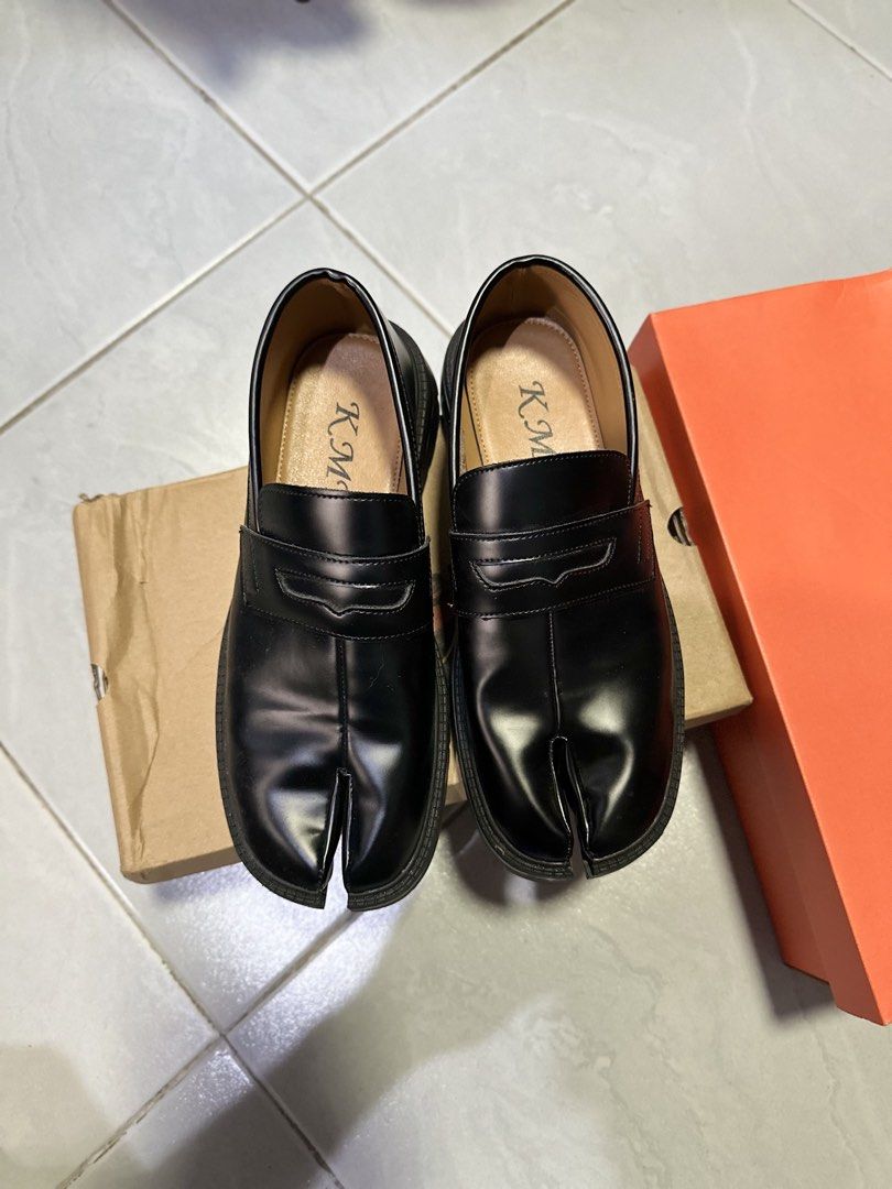 KMY Matte Black Split-Toe Tabi Loafers Size 41 (Category: Loafers) located in Makati City. Submitted by its.ptrck (Listing ID 1468114994, Image 2). Description: - Brand: KMY - Color: Matte black - Size: 41 - Design: Unique split-toe (tabi) with classic penny loafer strap - Sole: Chunky lug sole with excellent grip - Condition: Minimal wear on soles - Inclusion: Original branded box ingat .