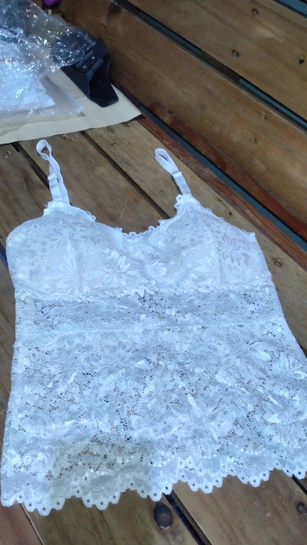 Korean lace sexy sando (Category: Sleeveless) located in Valenzuela. Submitted by diane.35 (Listing ID 1468094652, Image 1). Description: - Color: White with all-over floral lace pattern - Straps: Adjustable thin straps for a custom fit - Details: Trendy scalloped hem design - Fabric: Soft, textured, and highly breathable - Styling: Ideal for hot weather or as a layering piece.