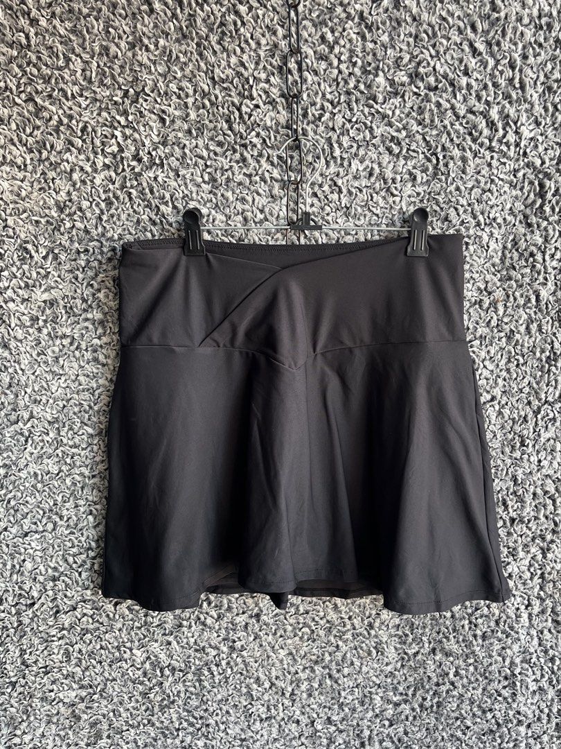 Kyodan Athletic Tennis Skort | Size L (Category: Skirts) located in General Trias. Submitted by zrchustle.604 (Listing ID 1468280582, Image 2). Description: skort (a skirt with built-in shorts) from the activewear brand Kyodan. This specific garment features their signature geometric "K" logo centered on the back waistband. Founded in Montreal, Canada, Kyodan focuses on affordable, functional athleisure and activewear designed for activities like
