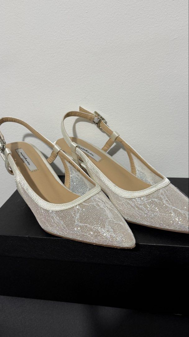 Lace Slingback Heels (Category: Heels) located in Manila. Submitted by ellaine08 (Listing ID 1468076831, Image 2). Description: Elegant and sparkly heels, perfect for weddings, parties, and special occasions! Color: Champagne Silver Design: Glitter pointed toe Style: Slingback with ankle strap Size: 7 (2 inches heels) Condition: New, Used Once Price: 1,000 Message me if interested! 💌.