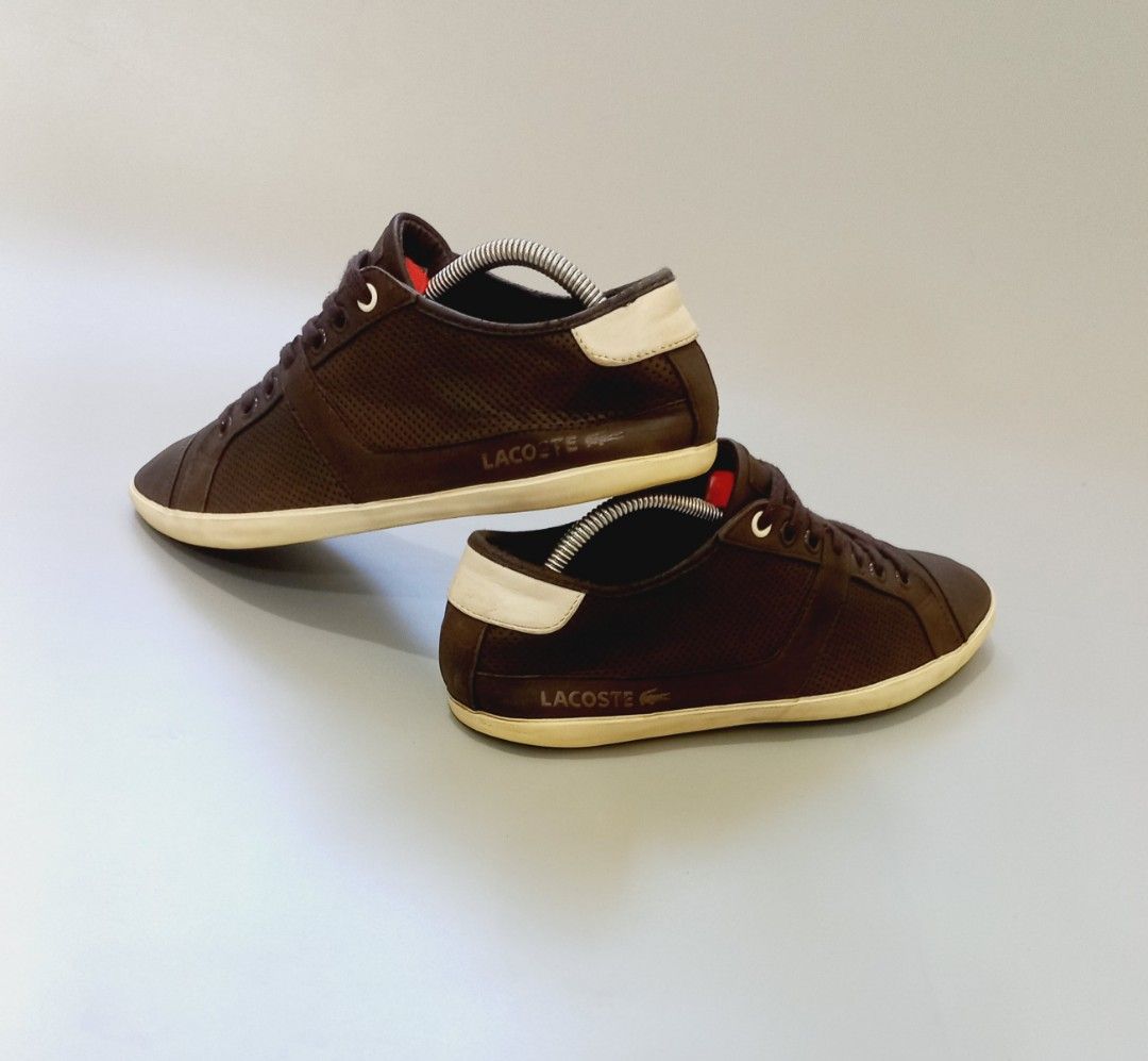 Lacoste Brown Perforated Leather Sneakers (Category: Sneakers) located in Cebu City. Submitted by MrLiks_123 (Listing ID 1468105195, Image 1). Description: - Brand: Lacoste - Material: Premium brown leather - Design: Classic low-top with dark brown laces - Details: Perforated sides and top for breathability - Accents: Contrasting cream heel patch and debossed crocodile logo - Sole: Durable matching rubber sole - Style: Versatile everyday casual w