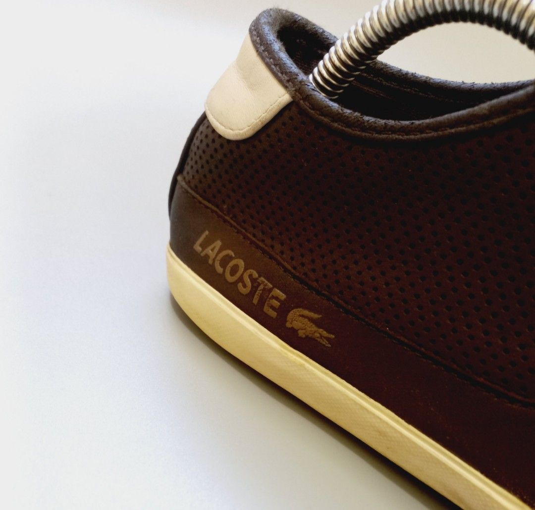 Lacoste Brown Perforated Leather Sneakers (Category: Sneakers) located in Cebu City. Submitted by MrLiks_123 (Listing ID 1468105195, Image 3). Description: - Brand: Lacoste - Material: Premium brown leather - Design: Classic low-top with dark brown laces - Details: Perforated sides and top for breathability - Accents: Contrasting cream heel patch and debossed crocodile logo - Sole: Durable matching rubber sole - Style: Versatile everyday casual w