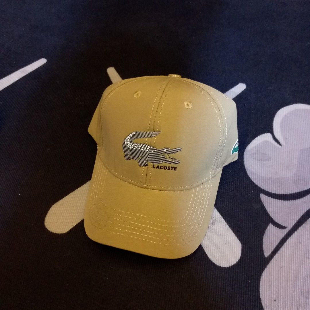 Lacoste Khaki Snapback Cap with Large Crocodile Logo (Category: Caps & Hats) located in Manila. Submitted by pablopresk0. (Listing ID 1468167920, Image 1). Description: FS!🐊 PREMIUM QUALITY✅🧢 MANILA LOCATION📍 PM IF INTERESTED📩.