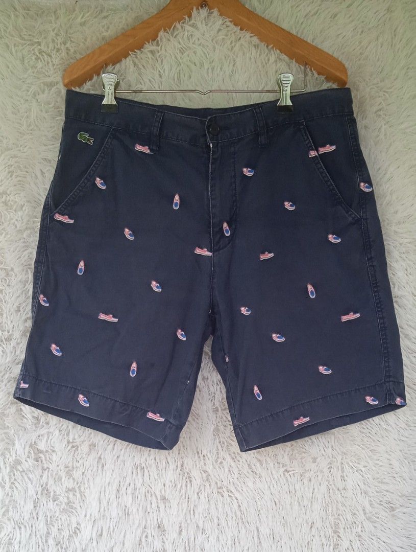Lacoste Live embroidered boat shoe logo (Category: Shorts) located in Davao. Submitted by lee_ly (Listing ID 1468074991, Image 1). Description: "From UKAY SOURCE" LACOSTE LIVE - lightly used (since this is from UKAY)but still in very good condition - color:navy blue with embroidered boat shoe logo - embroidered lacoste logo - color rate: 9/10 - W 34 L 19 (actual measurement).