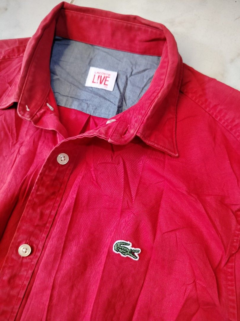 Lacoste Live Red Long Sleeve Button Down Shirt (Category: Tshirts & Polo Shirts ) located in Manila. Submitted by virgiliosa38485 (Listing ID 1468100379, Image 2). Description: - Brand: Lacoste Live -29×19 - Style: Long sleeve button-down shirt (CH4654) - Color: Bright red with contrast blue inner collar - Material: 100% breathable cotton - Details: Signature crocodile logo on chest, standard collar, front button closure - Condition: Clean, versa